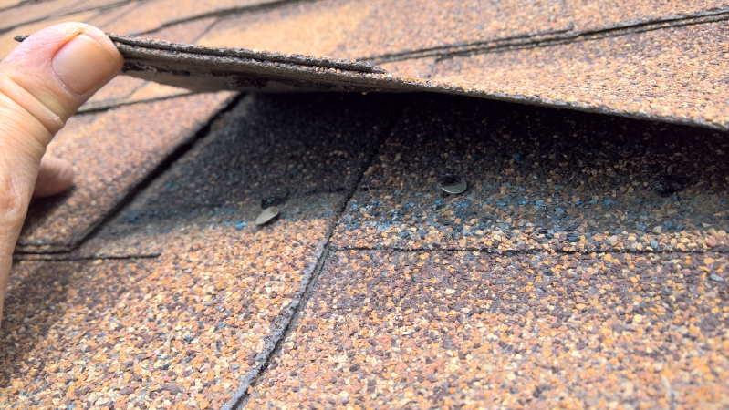 FSN One field shingle nail driven crooked-both underdriven-one placed too high missing 2nd part of laminated shingle